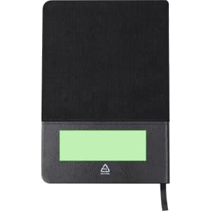 A black notepad featuring a green section at the bottom and a logo. It has a ribbon bookmark for easy access.