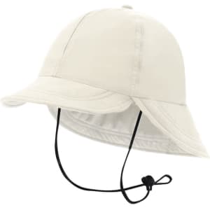 A cream-coloured cap with a wide brim and adjustable chin strap, featuring a logo on the front.