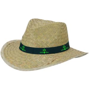 A straw hat in a natural beige colour, featuring a dark green band and a logo on the band.