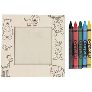 A wooden photo frame decorated with animal illustrations, accompanied by four crayons in black, red, blue, and yellow.