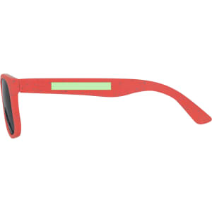 Kids' sunglasses in bright red with a sleek design and black lenses, featuring a logo on the side.
