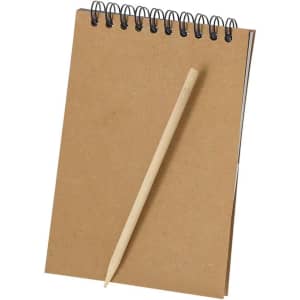A brown spiral-bound notebook with a wooden pencil resting against it. The notebook has a simple, natural appearance.