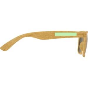 A pair of sunglasses with a wooden frame and a mint green accent on the side.