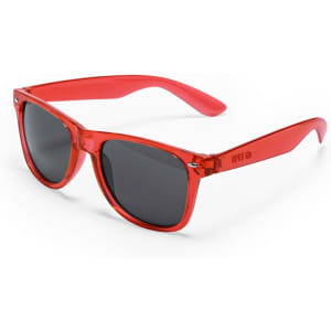 Red sunglasses with a clear frame and dark lens, featuring a logo on the arm. Ideal for leisure and outdoor activities.
