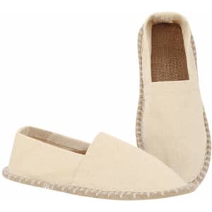 A pair of beige espadrilles with a casual design and stitched detailing, featuring a soft fabric upper.