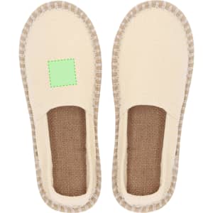 A pair of cream-coloured espadrilles with a jute insole and a simple design, featuring a branding area.