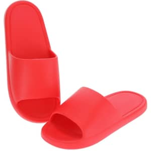 A pair of red flip flops with a simple design and a logo on one. Suitable for casual wear.