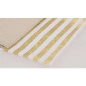 A bath towel featuring alternating gold glitter and white stripes, alongside a plain beige towel.