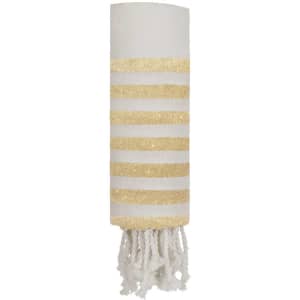 A white and gold striped towel with tassels at one end, featuring a logo. Ideal for bath or beach use.