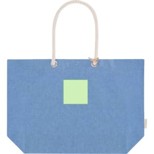 A blue tote bag with a green square and rope handles. The bag features a logo on the side.