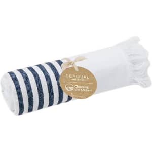 A navy and white striped towel rolled up with a tag, featuring a textured edge. It has a logo.