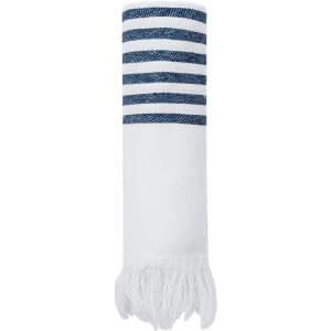 A rolled towel with navy blue stripes and white fringe at one end. It has a branded logo.