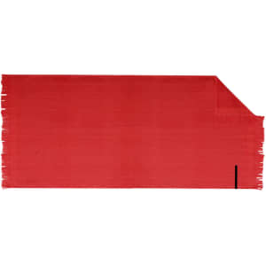 A red bath towel with fringed edges and a small logo on one side.