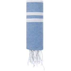 A rolled blue towel with white stripes and fringed ends, featuring a branding logo.