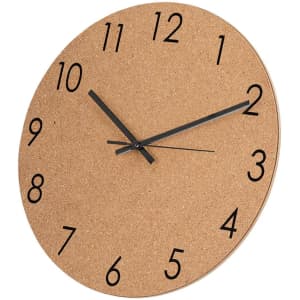 A round cork wall clock with black numbers and hands, featuring a minimalist design suitable for home decor.