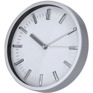A round wall clock with a silver frame and white face, featuring minimalist silver hour markers and hands.