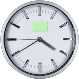 A wall clock with a silver casing, white face, and black hour markers. It features two black hands and a logo.