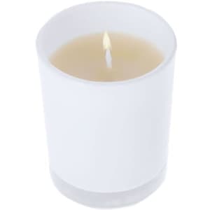 A white aromatic candle in a clear glass holder, featuring a single flame.