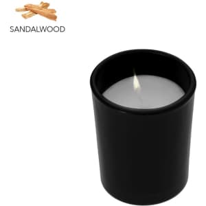 A black aromatic candle with a white wax interior, featuring a lit wick and sandalwood scent.