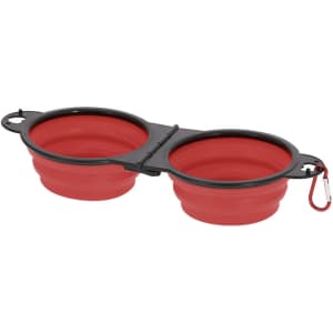 A foldable pet bowl in red and black, featuring two compartments linked with a clip for easy storage.