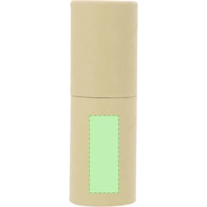 A cylindrical, beige travel container with a green label area. It has a simple design and a secure top.