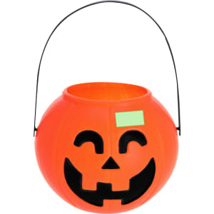 An orange Halloween basket with a jack-o'-lantern face and a black handle.