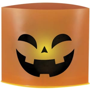 An orange candle holder with a black pumpkin face design, perfect for Halloween decor.