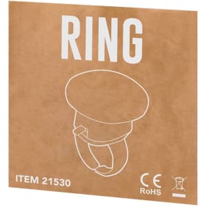 A novelty ring with a cartoonish design, presented on a brown cardboard backing. It features a logo.