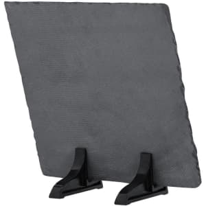 A grey sublimation plaque displayed on a black stand, featuring a textured surface and irregular edges.
