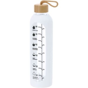 A drink bottle made of clear glass with a bamboo lid and a measurement scale along the side.