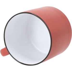 A coffee mug in coral with a white interior and a black rim, featuring a handle and a smooth finish.