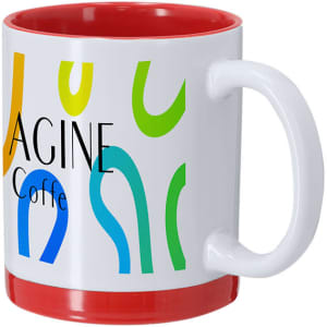 A coffee mug featuring a white exterior with colourful abstract designs and a red interior. It has a handle and a logo.