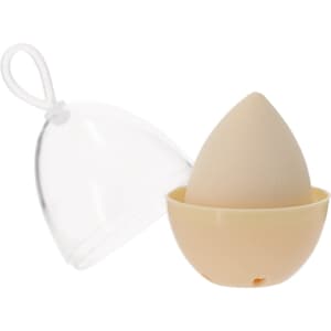 A beauty blender in an egg shape, designed in a light beige colour, housed in a clear protective case.