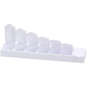A white pillbox with multiple compartments and flip-top lids, featuring a simple branding logo.