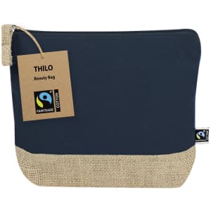 A navy blue beauty bag with a jute bottom and a tag indicating Fairtrade certification. It features a zipper closure.