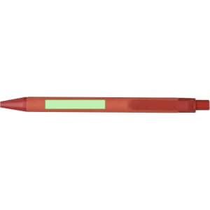 A red pen with a clip and a blank area for branding. The pen has a pointed tip for writing.