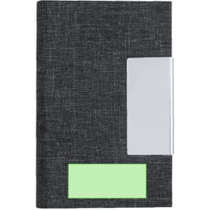 A dark grey notebook with a silver clip and a green label section. It features a textured fabric cover.