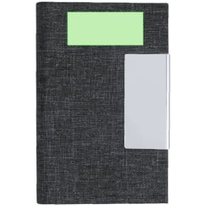 A dark grey notebook with a green label and a silver clip on the side.