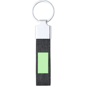 A keyring featuring a silver metal loop and a black fabric strap with a green rectangular accent.