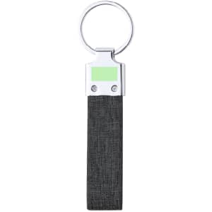 A keyring with a silver metal top and a dark grey fabric strap, featuring a logo on the metal part.