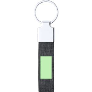 A keyring featuring a silver ring and a black textured strap with a green rectangular section.