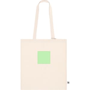 A beige tote bag with long straps features a green square on the front and a logo at the bottom.