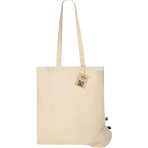 A cream-coloured tote bag with long handles, featuring a branding tag and a foldable design.