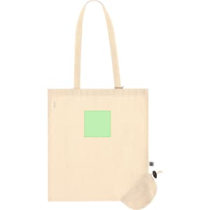 A cream-coloured tote bag with a foldable design and a small pouch for storage. The bag has a logo.