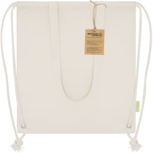 A cream drawstring cool bag made from recycled material, featuring a simple design and a tag attached.