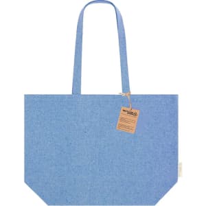 A blue tote bag with two handles and a tag, featuring a simple design. It has a logo or branding element.