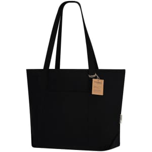 A black tote bag with two long handles and a spacious front pocket. It features a tag and a logo.