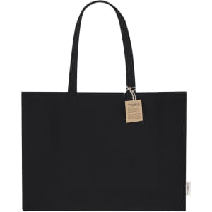 A black tote bag with long handles and a small tag attached. The bag features a logo.