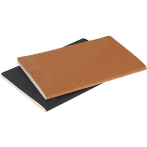 Two notebooks are stacked, one in brown and the other in black, featuring a simple design and a logo.