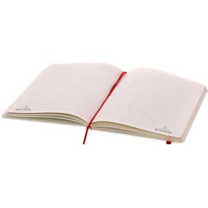 A notepad with lined pages, a ribbon bookmark, and a cream cover, displaying a logo on the bottom corner.